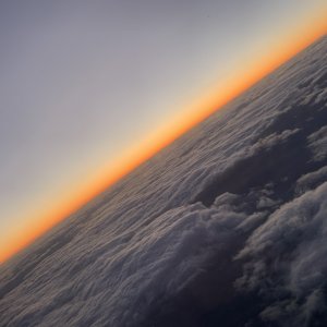 Sunset over the clouds